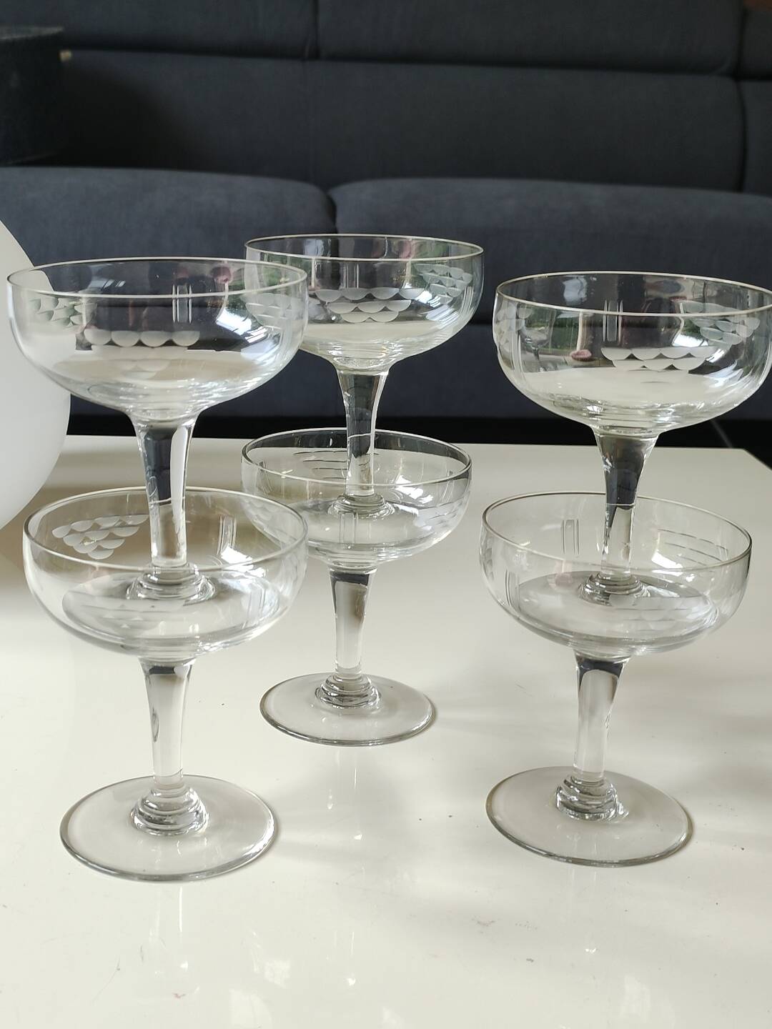 Set of 6 Baccarat-style champagne glasses. Stylized grape cluster decoration.