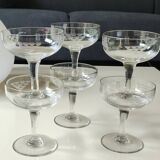 Set of 6 Baccarat-style champagne glasses. Stylized grape cluster decoration.
