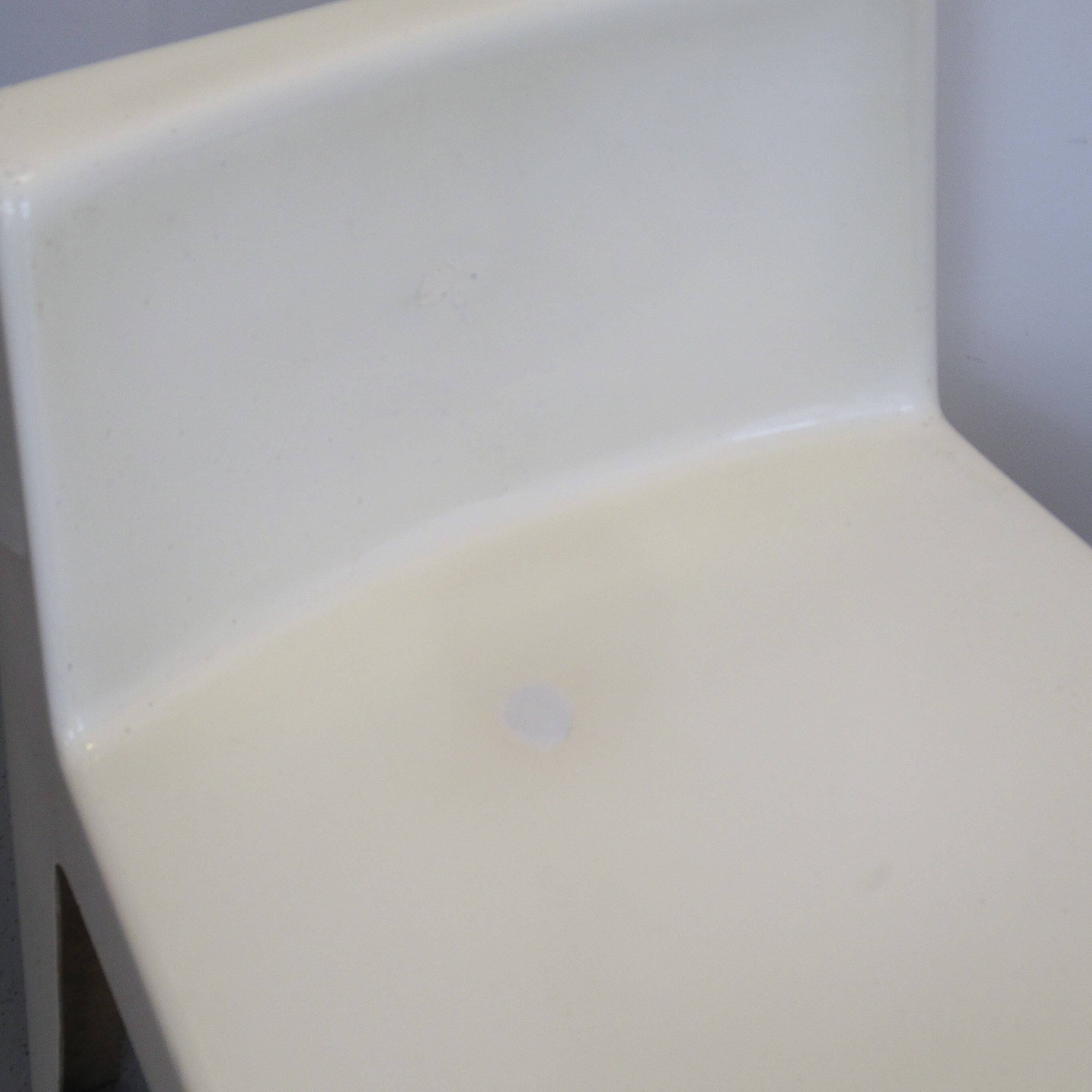 Two white fiberglass Kostka chairs 1970