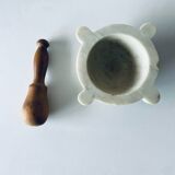 Old marble mortar with wooden pestle