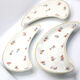 Ravier lune aux motifs de fleurs et liseré or en porcelaine de Limoges