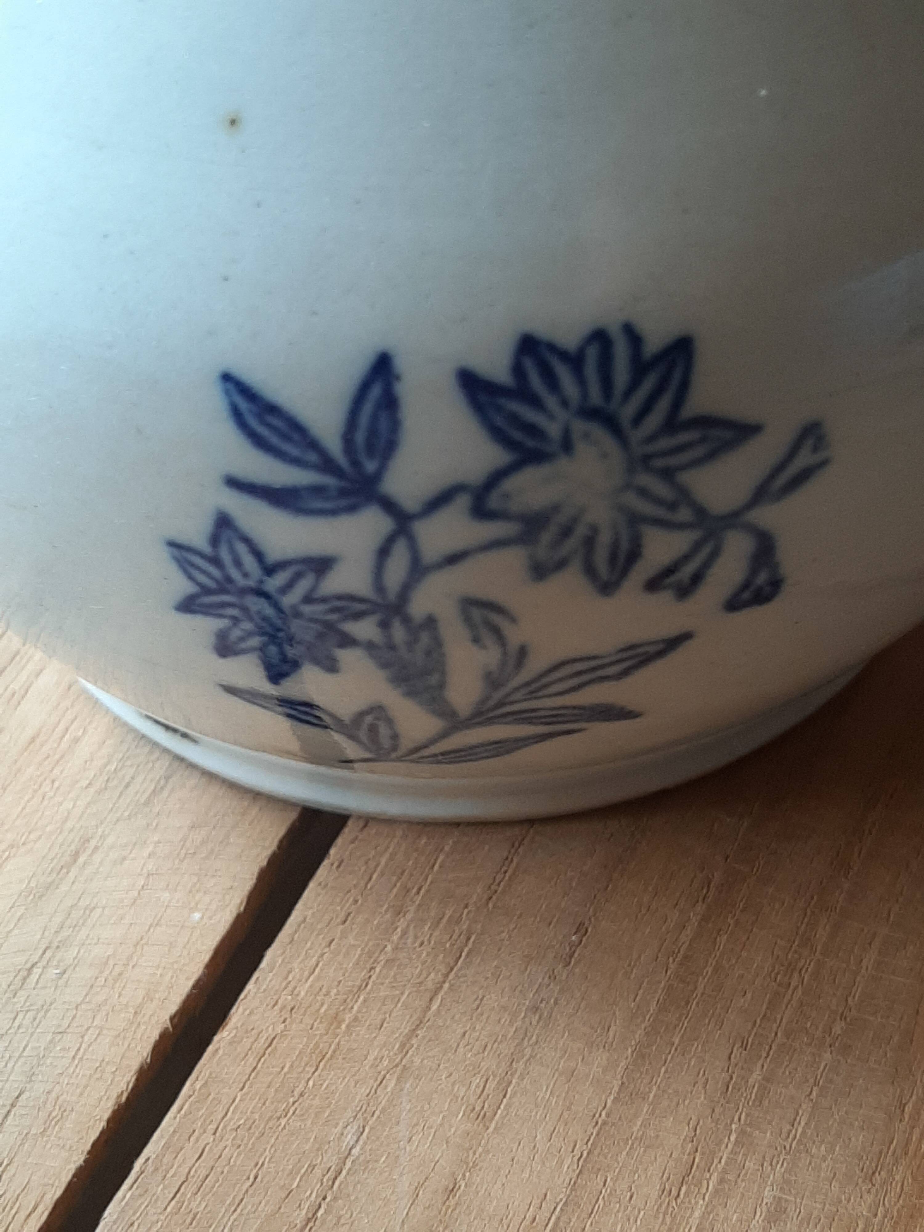 Large antique cruet in Saint Uze earthenware with blue flowers.