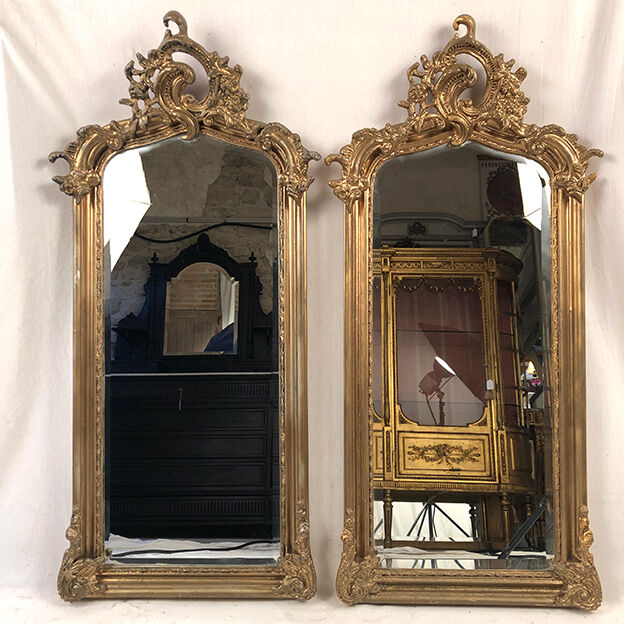 Pair of Louis XV style mirrors, stuccoed and gilded wood, beveled mirrors