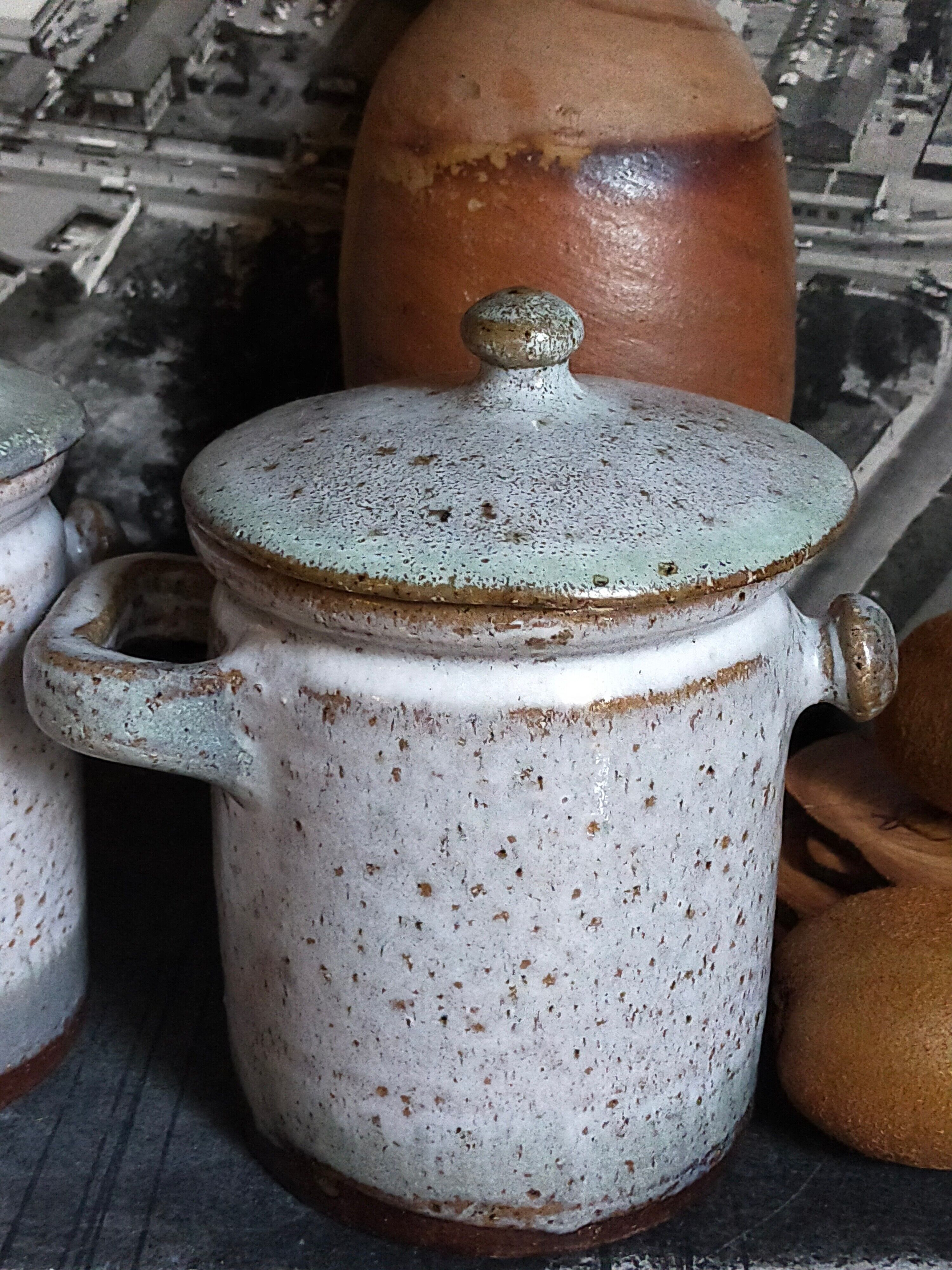 Duo of potter's pots covered in vintage glazed stoneware