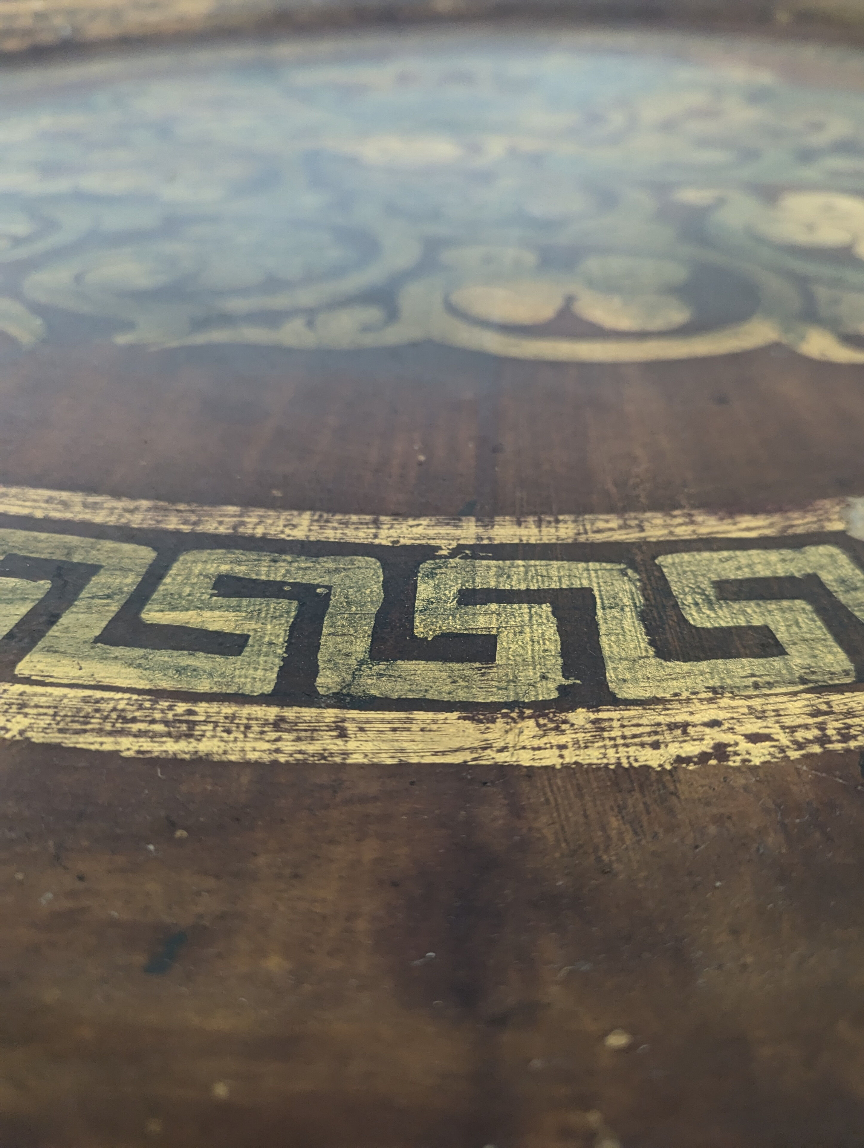 Moroccan table with painted sheet metal top and mother-of-pearl inlay