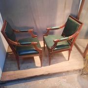 Pair of Louis XVI style armchairs upholstered in green leather.