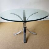 Round glass dining table, circa 1970.