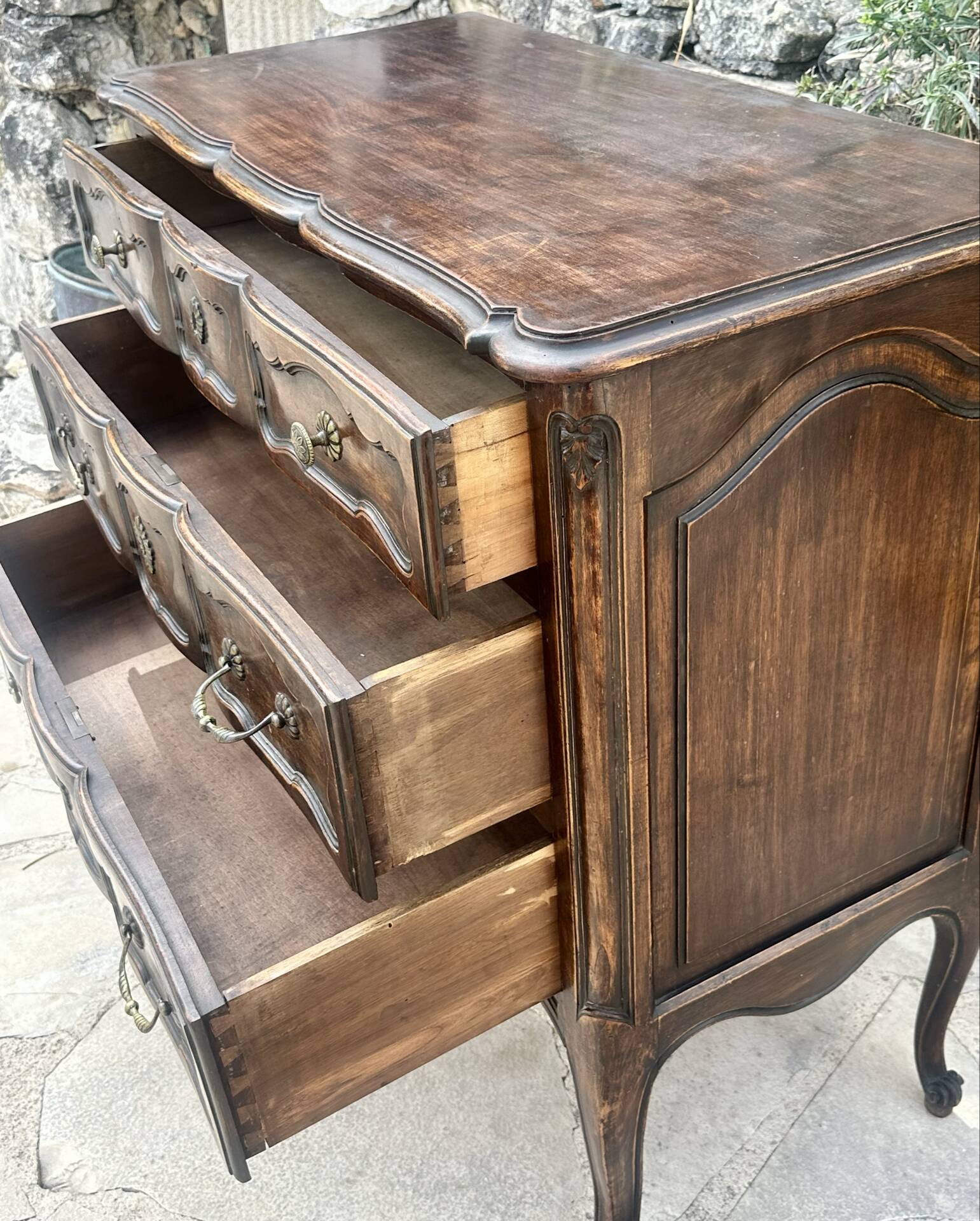 Carved and moulded solid wood commode in the Louis XV style.