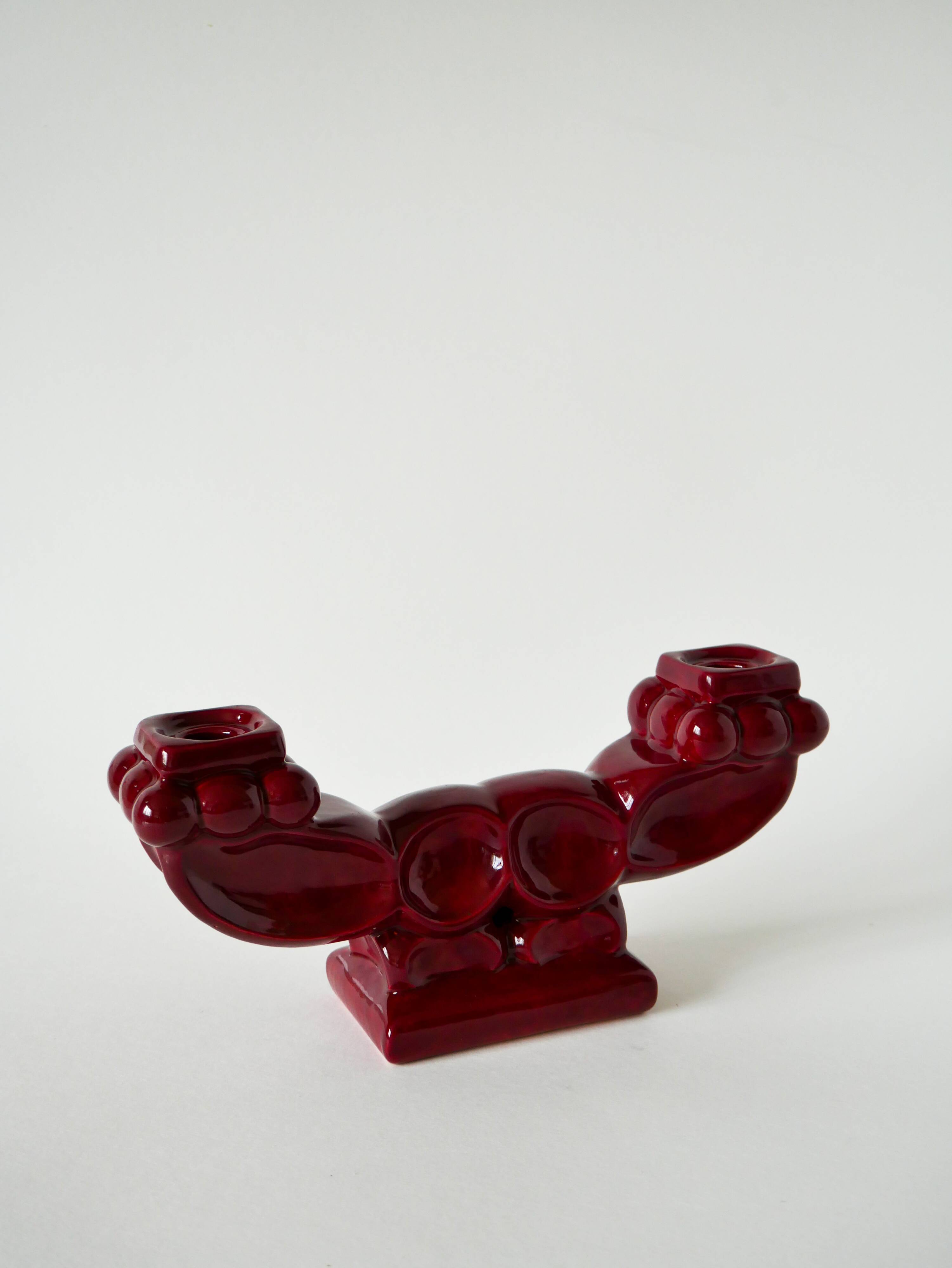 Pair of large burgundy ceramic candlesticks, 1950