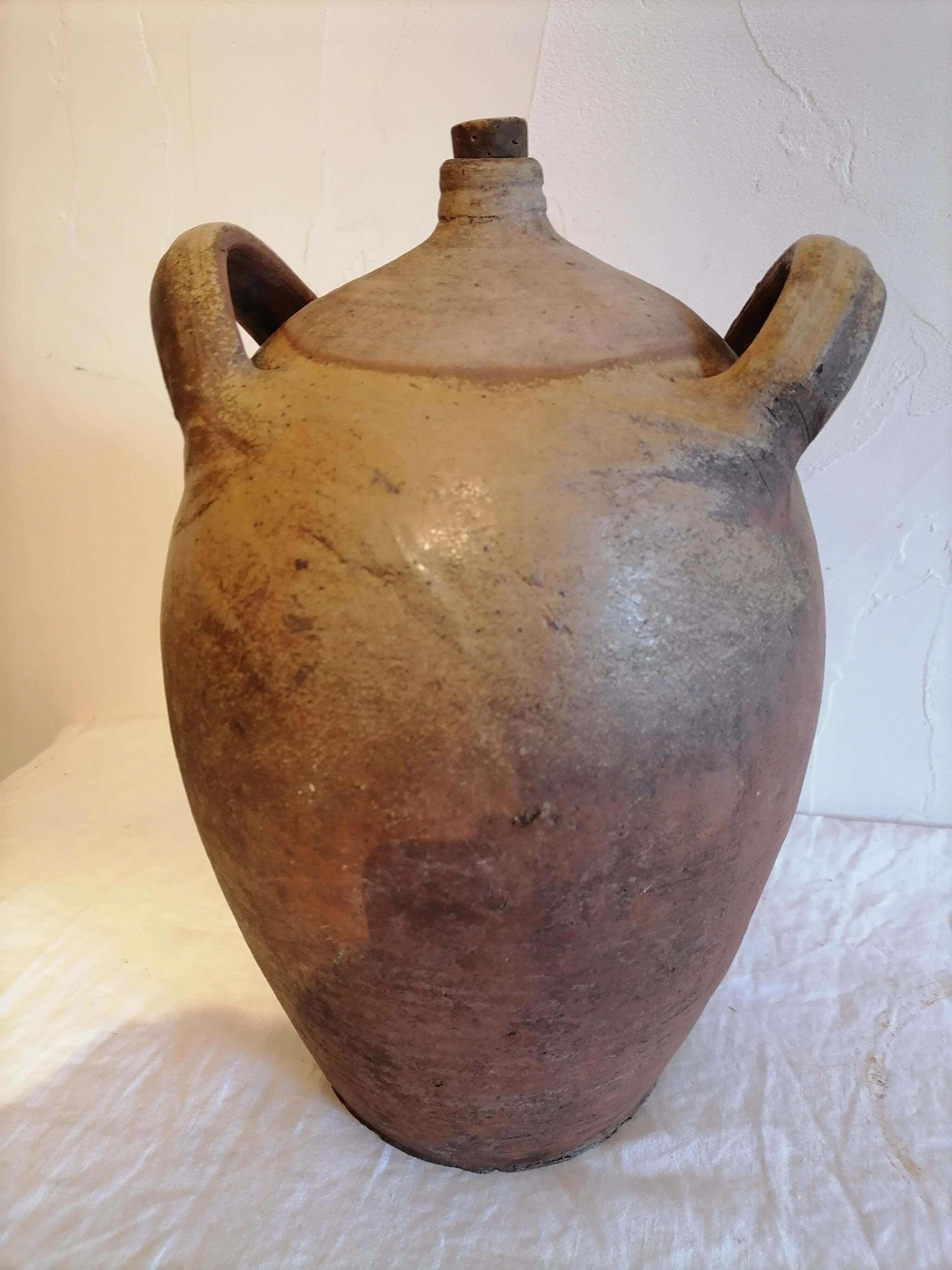 Old jar, glazed sandstone jug. Early twentieth century.