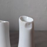 set of decorative vases composed of 11 white ceramic soliflores, evoking the delicate appearance of coral. In good general condition, despite some chips. Dimensions: 29.5 * 5.2 * 11.5 cm.