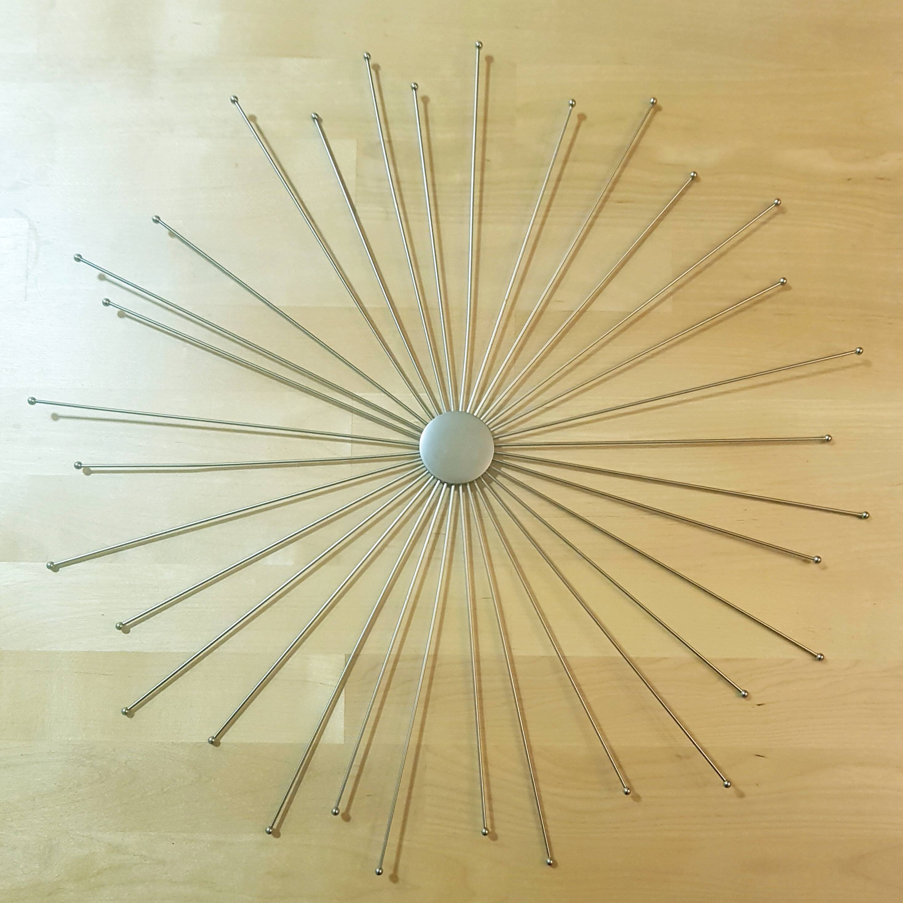 Alan Wisniewski starburst wall hanging