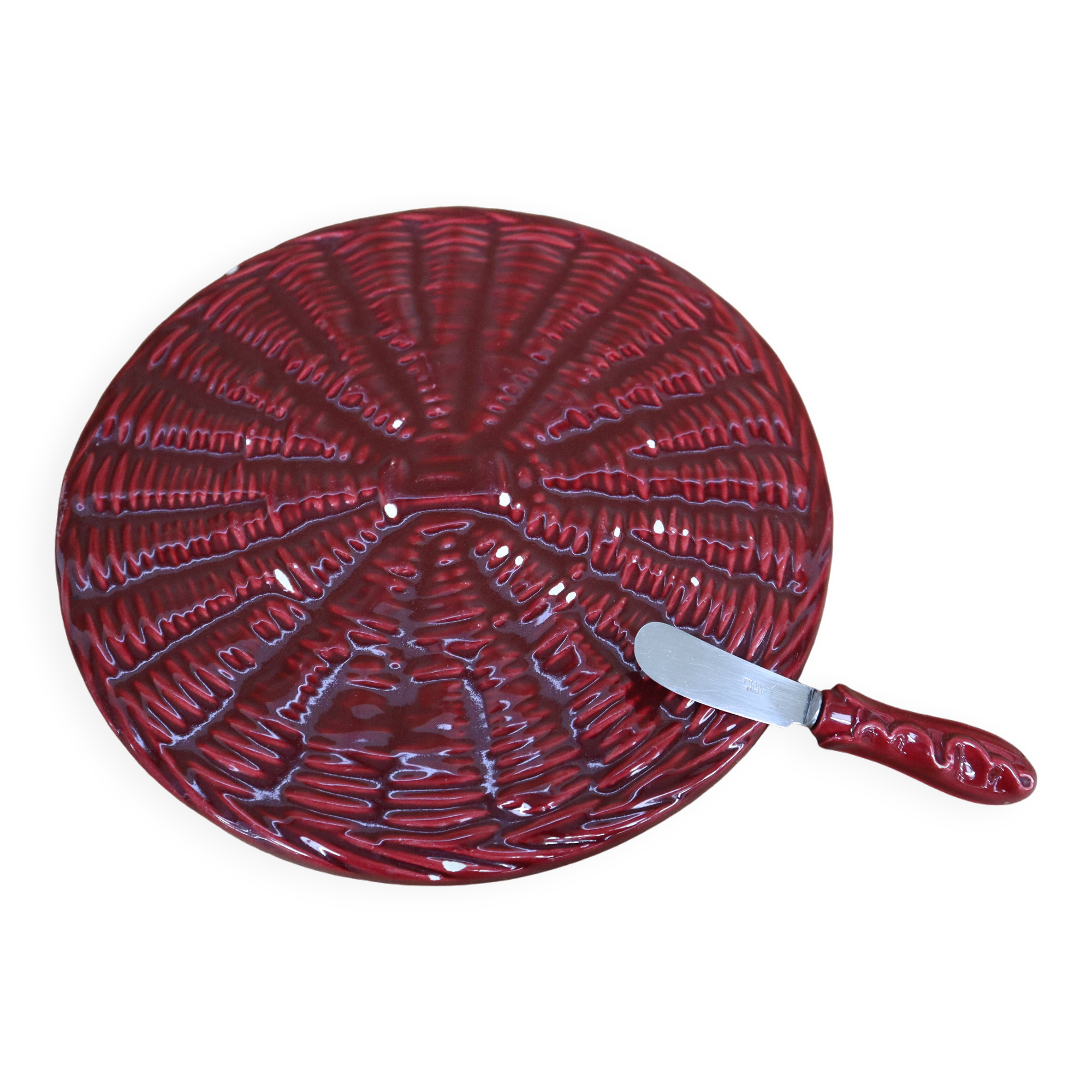 Burgundy slip tray and its small vintage knife from the 50s