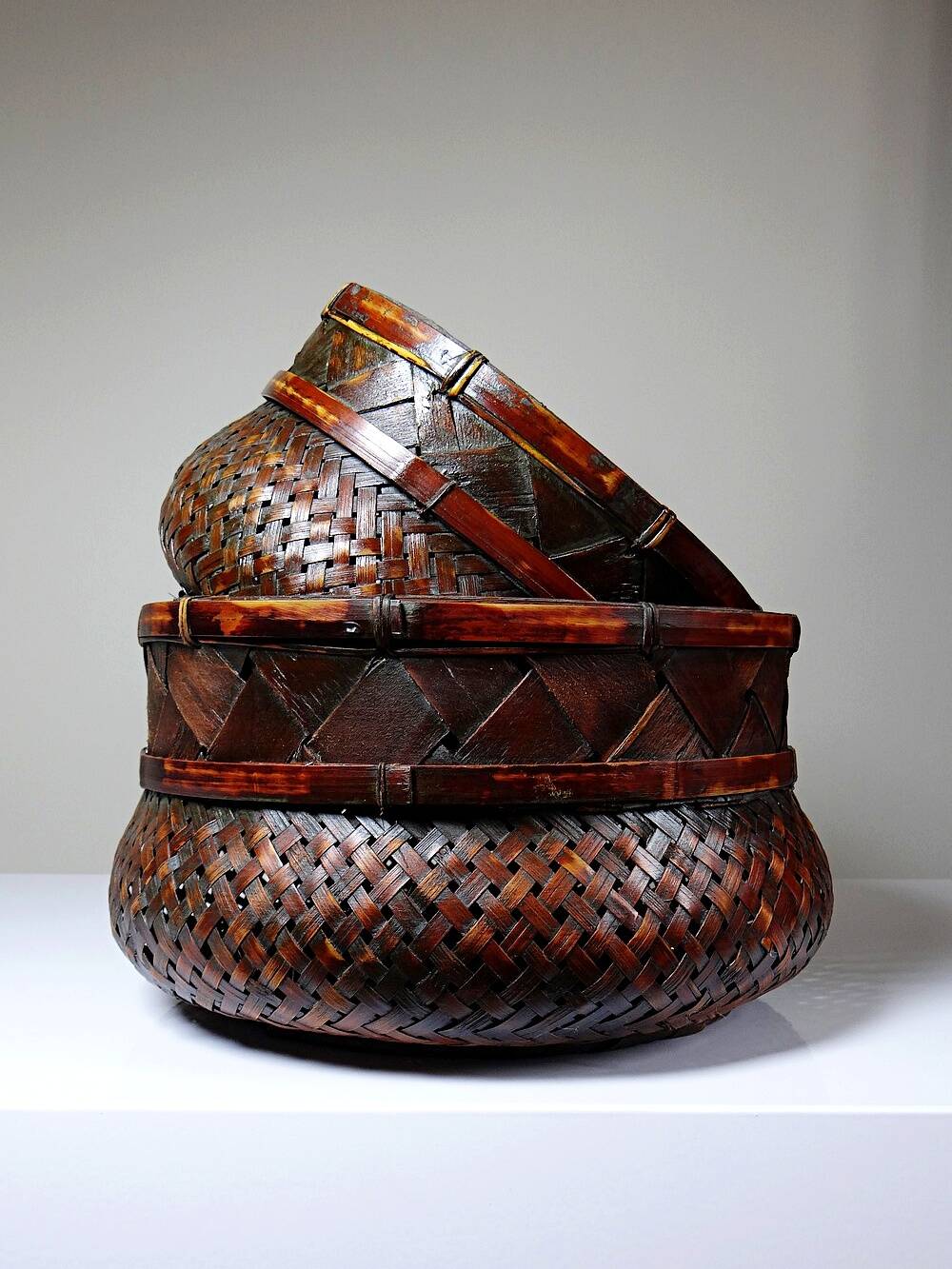 Pair of vintage nesting handmade Japanese woven bamboo baskets