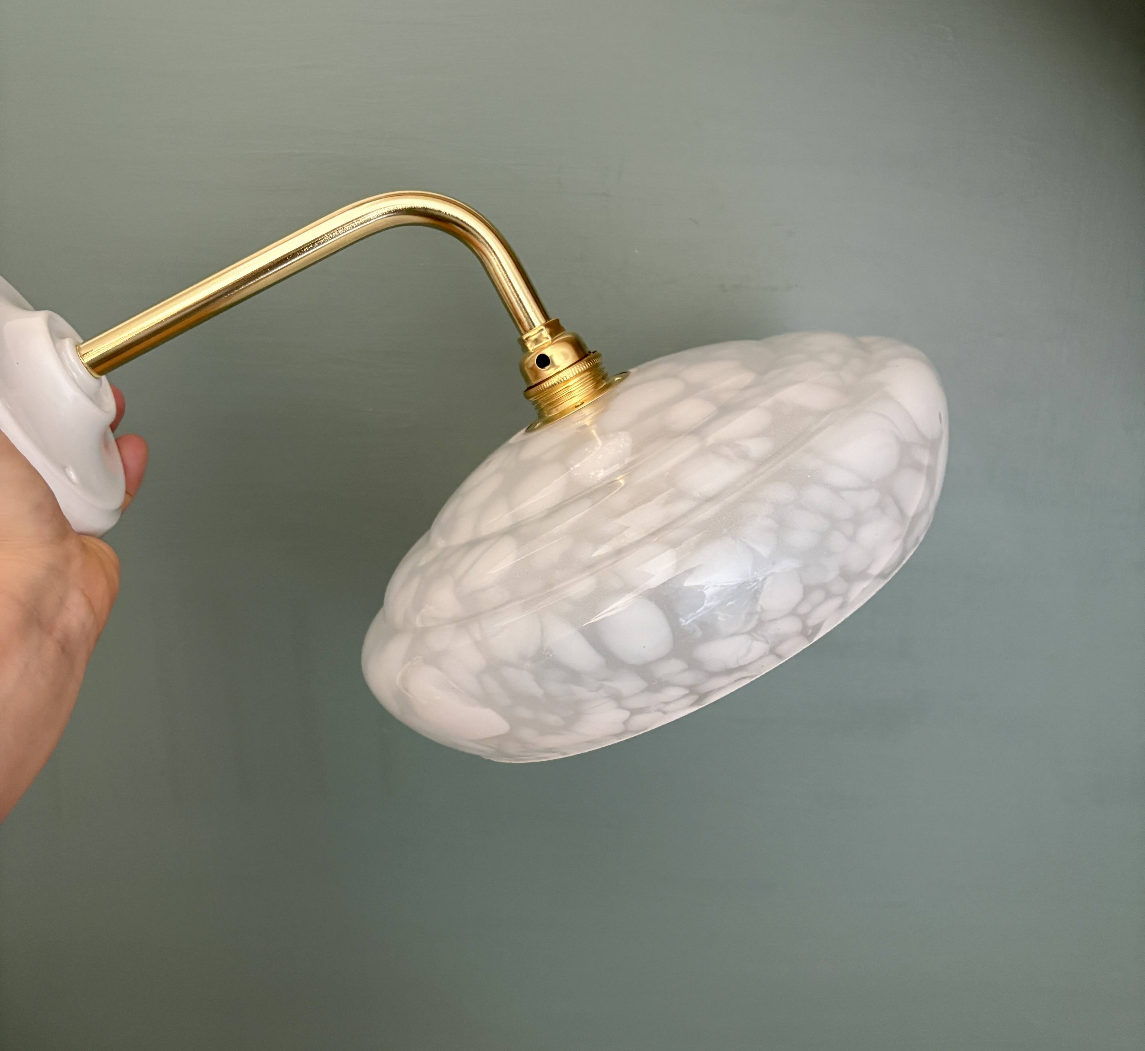 Vintage glass wall lamp with a white Clichy shade.