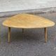 Scandinavian coffee table in the shape of a pebble/bean made of light solid wood from the years.
