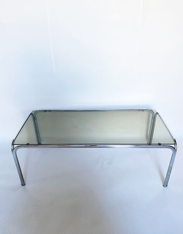 Metal table and smoked glass