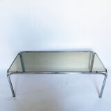 Metal table and smoked glass