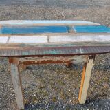 Oval table in polychrome wood