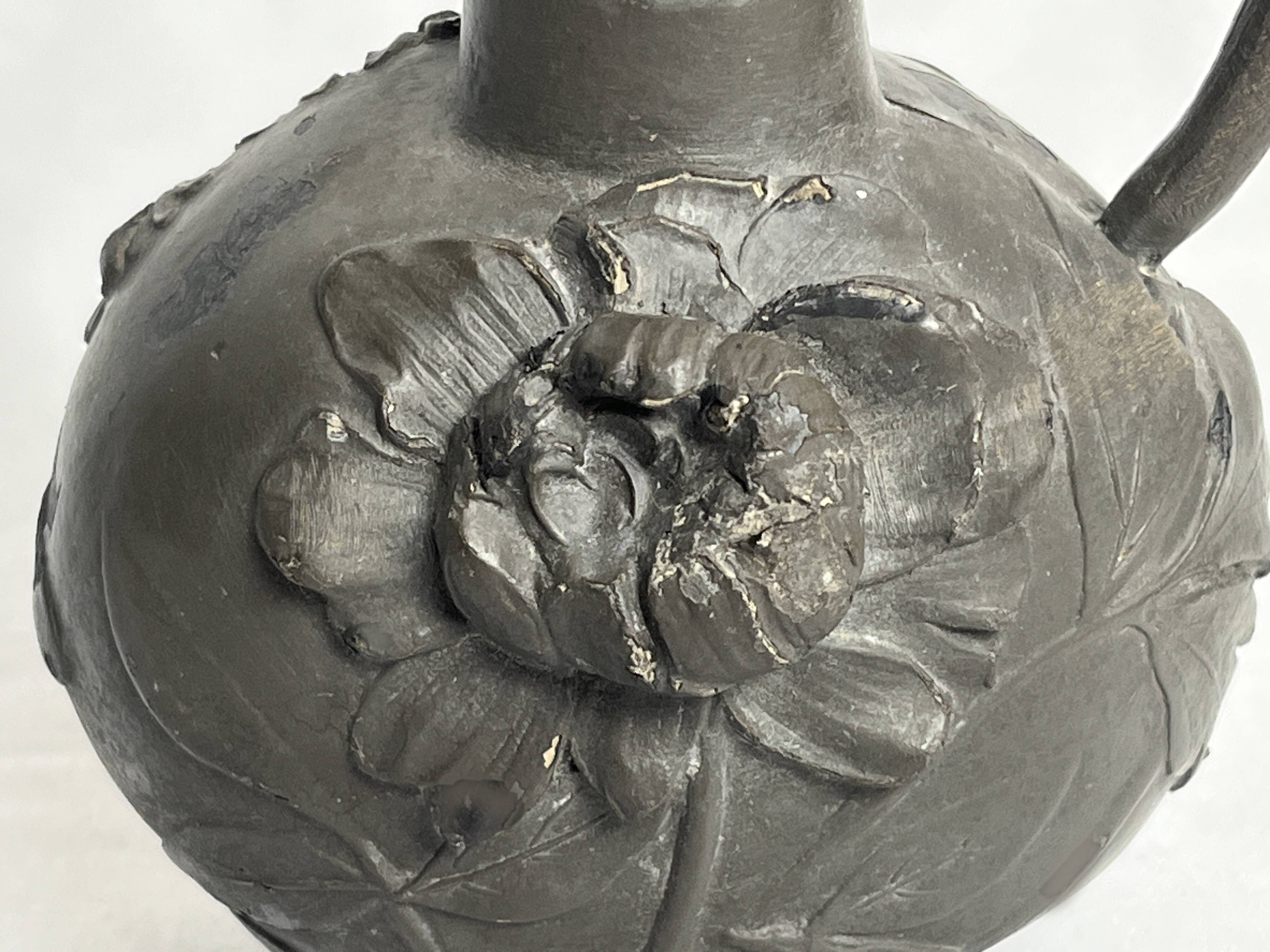 Art Nouveau, a single flower vase jug in pewter signed Petiz around 1900.