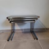 Set of 3 nesting tables with chrome metal legs and smoked glass from the 70s