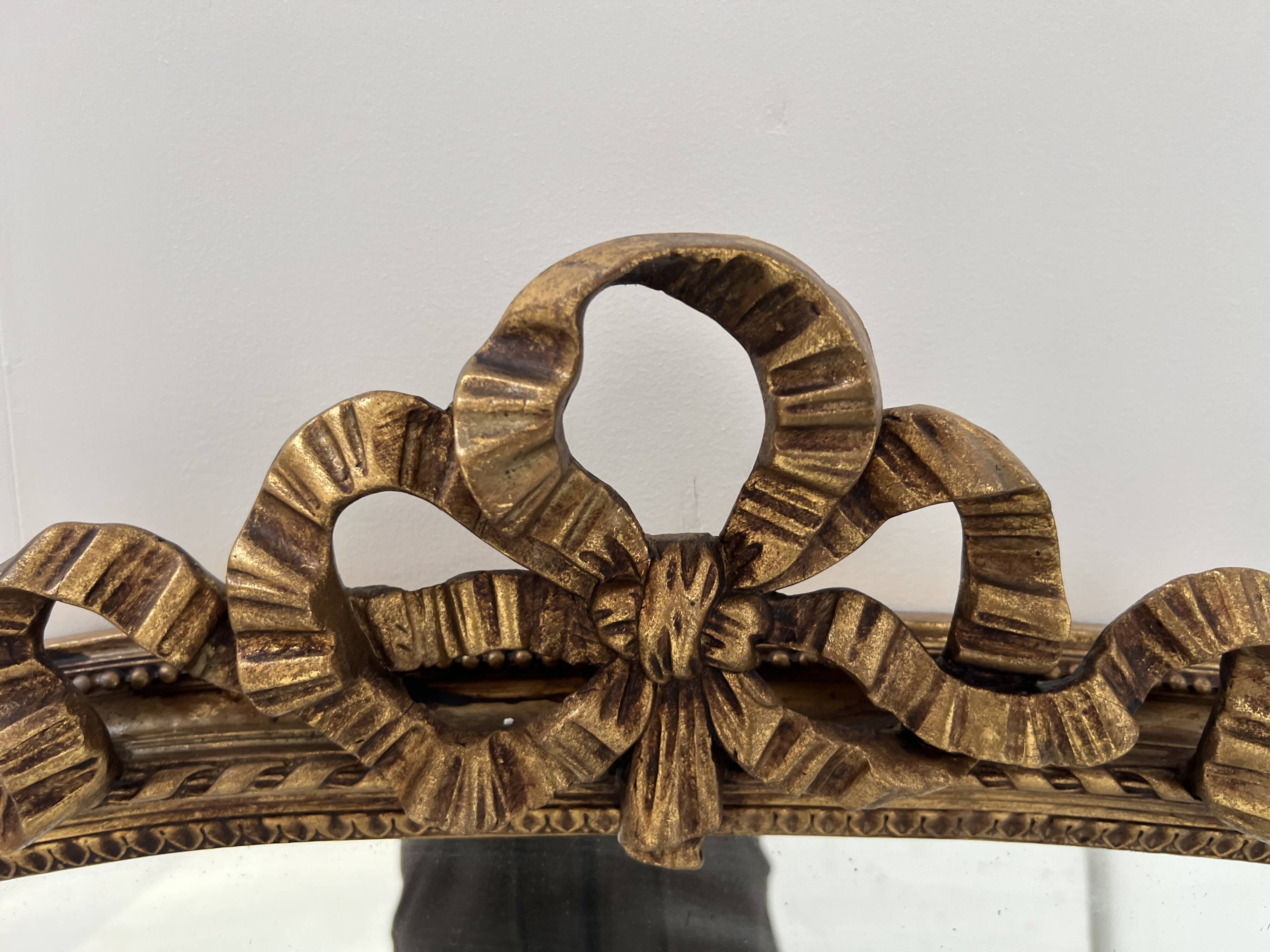 Louis XVI style mirror in wood and gilded stucco, 19th century