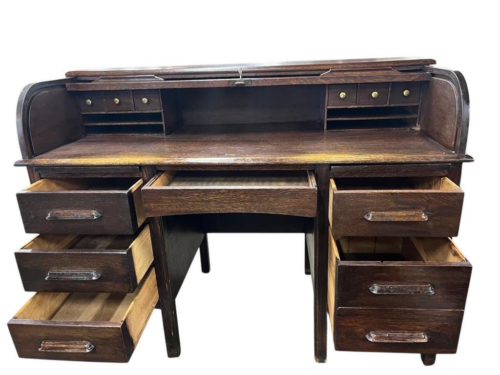 Vintage American wooden desk with a roll-top.