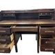 Vintage American wooden desk with a roll-top.