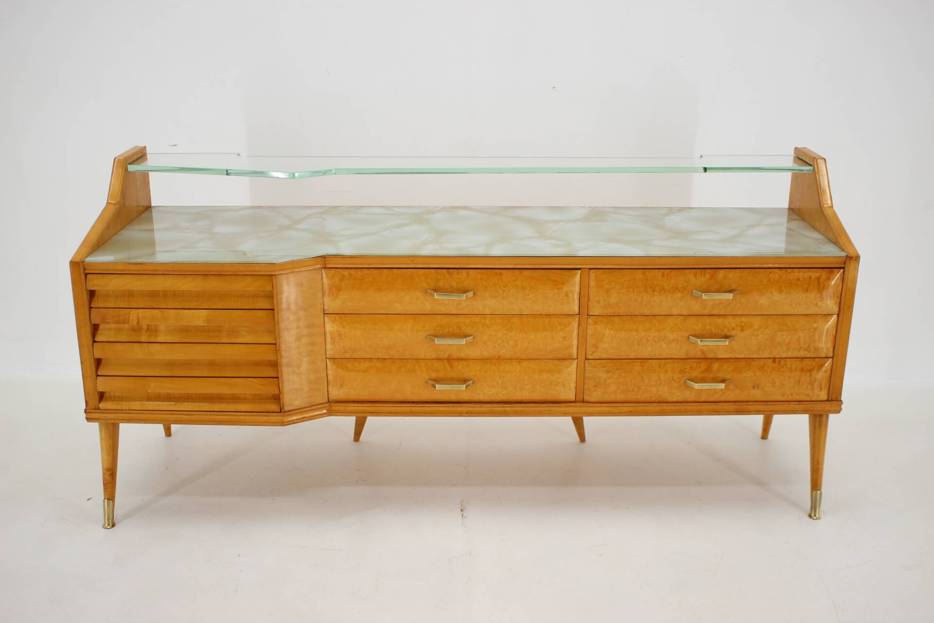 1960s italian sideboard/chest of drawers in high gloss finish with glass top and shelf