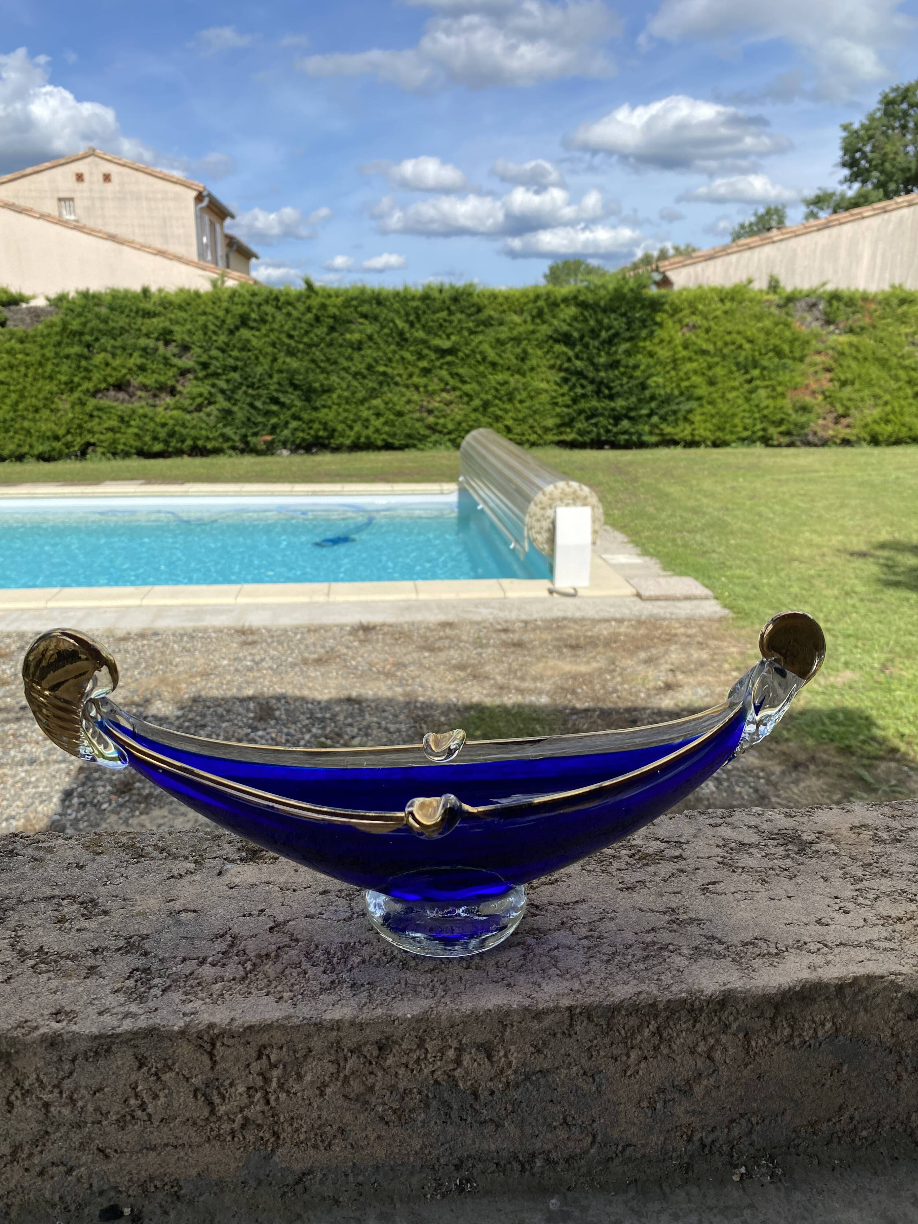 Vintage cobalt blue Murano glass gondola bowl with gilding.
