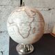 Decorative terrestrial globe on silver metal stand – explorer style