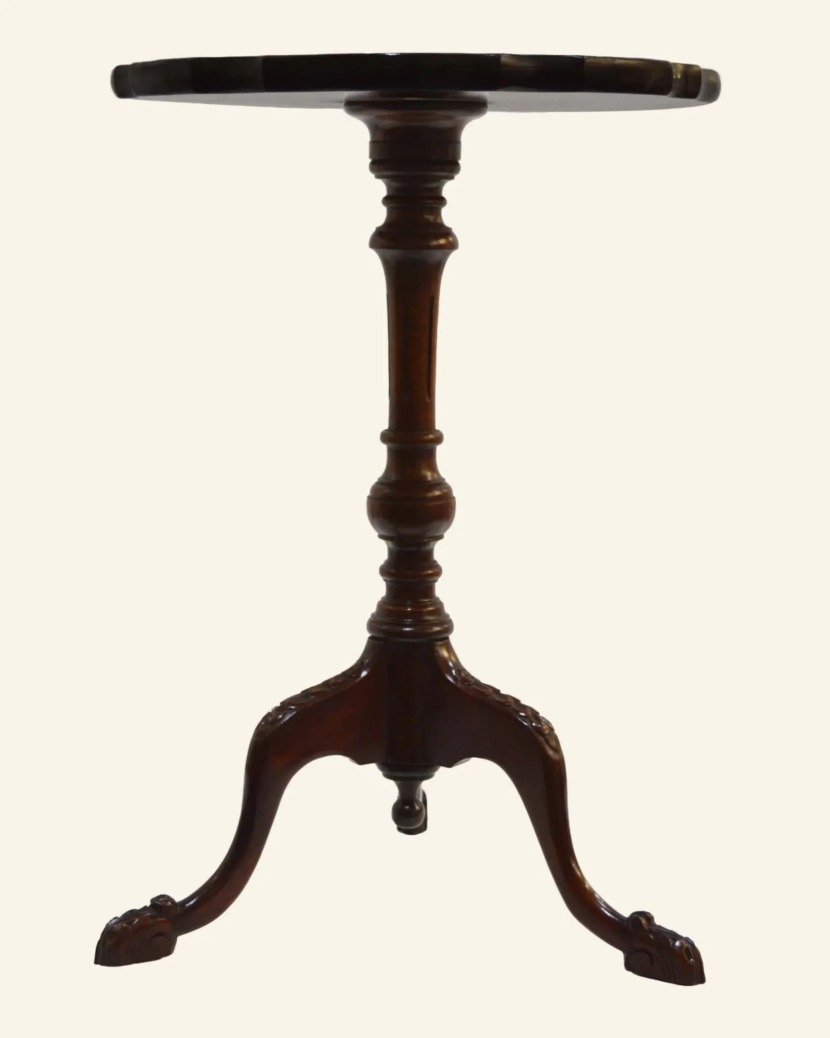 African mahogany guéridon, turned with a sculpted tripod leg.