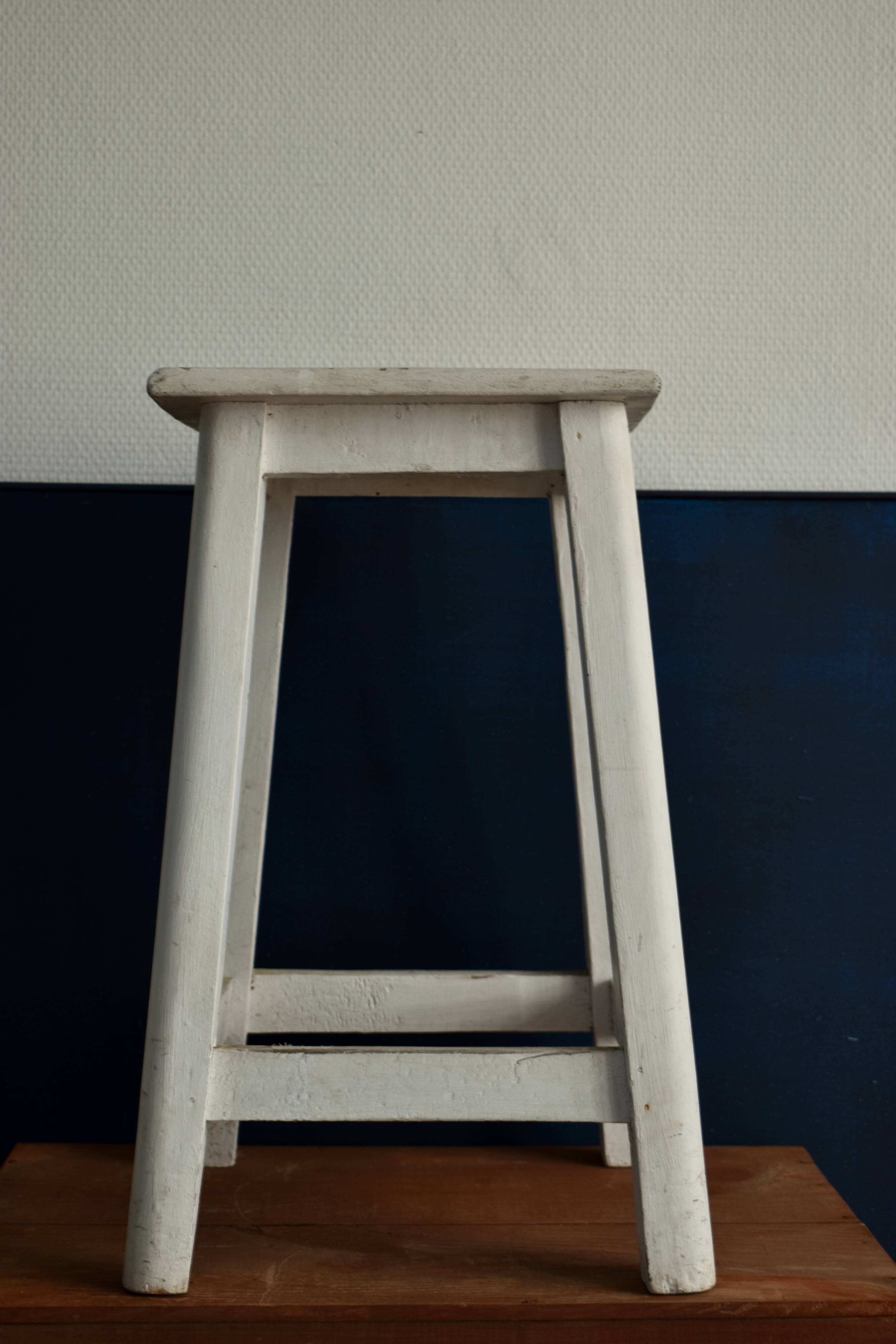 Old white wooden handle stool
