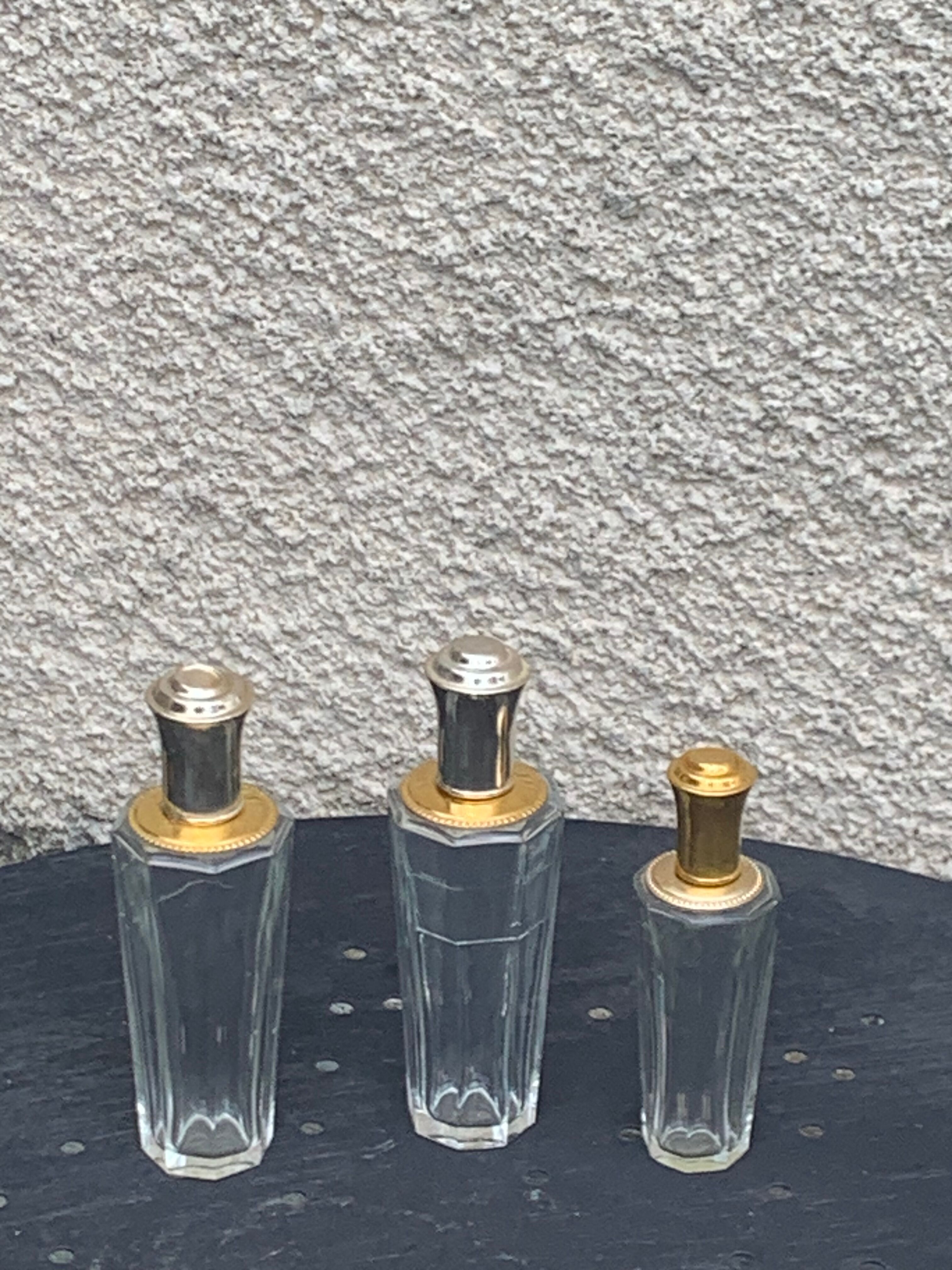 Three bottles of crystal perfume signed Marcel Rochas old france