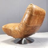 Vintage leather swivel chair with stool, 1970s