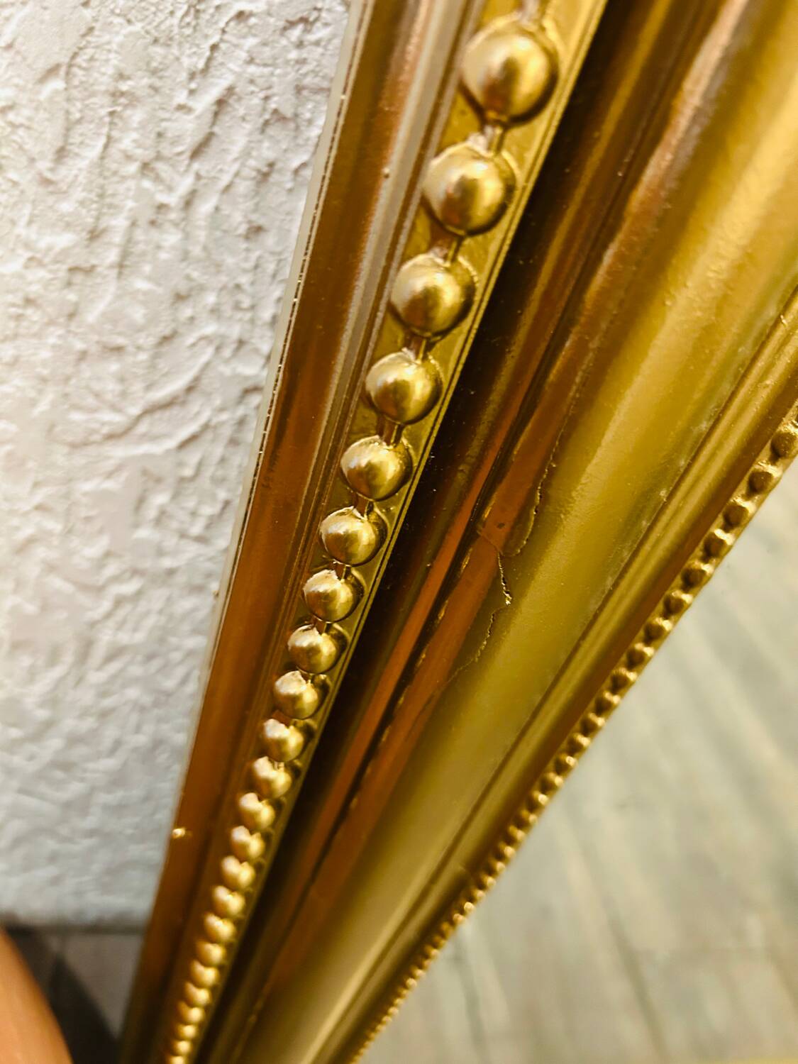 Antique gilded mirror in old Louis Philippe wood