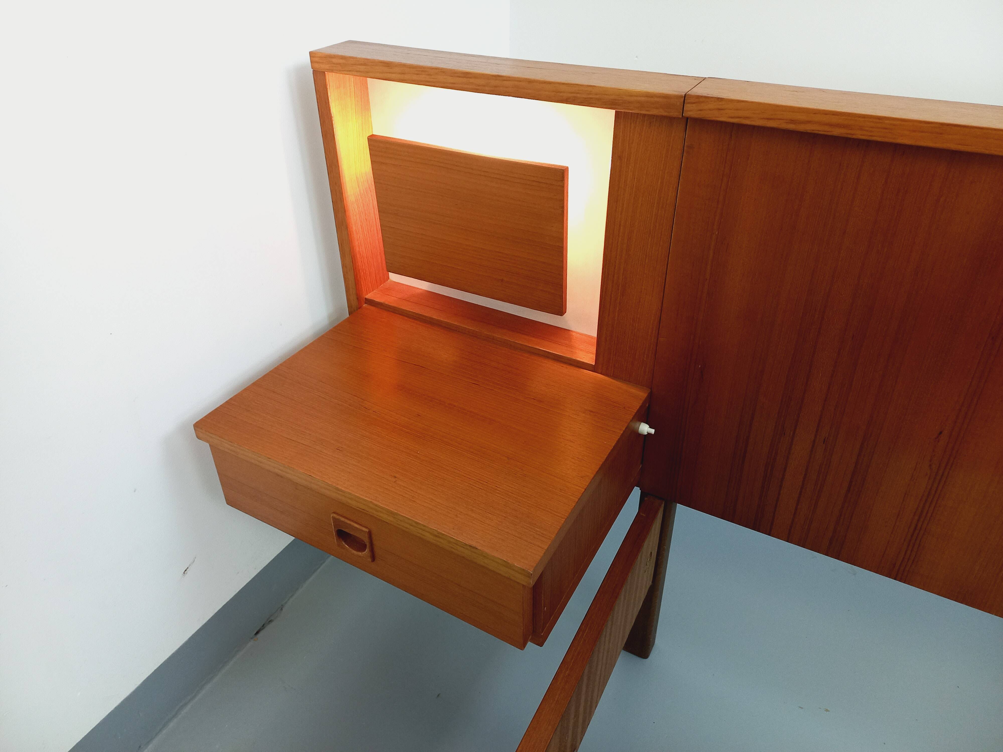 Vintage Scandinavian style double bed in teak from the 60s with integrated bedside lights