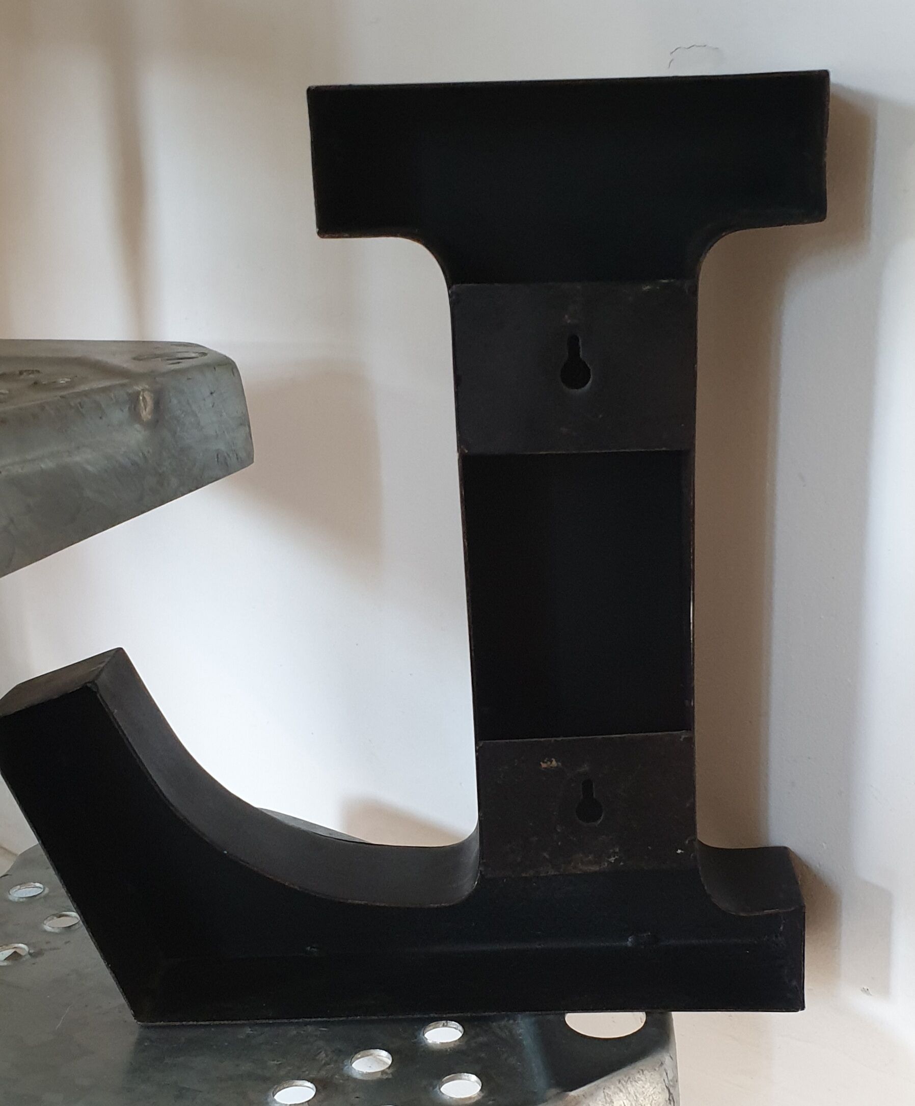 Letter l black metal