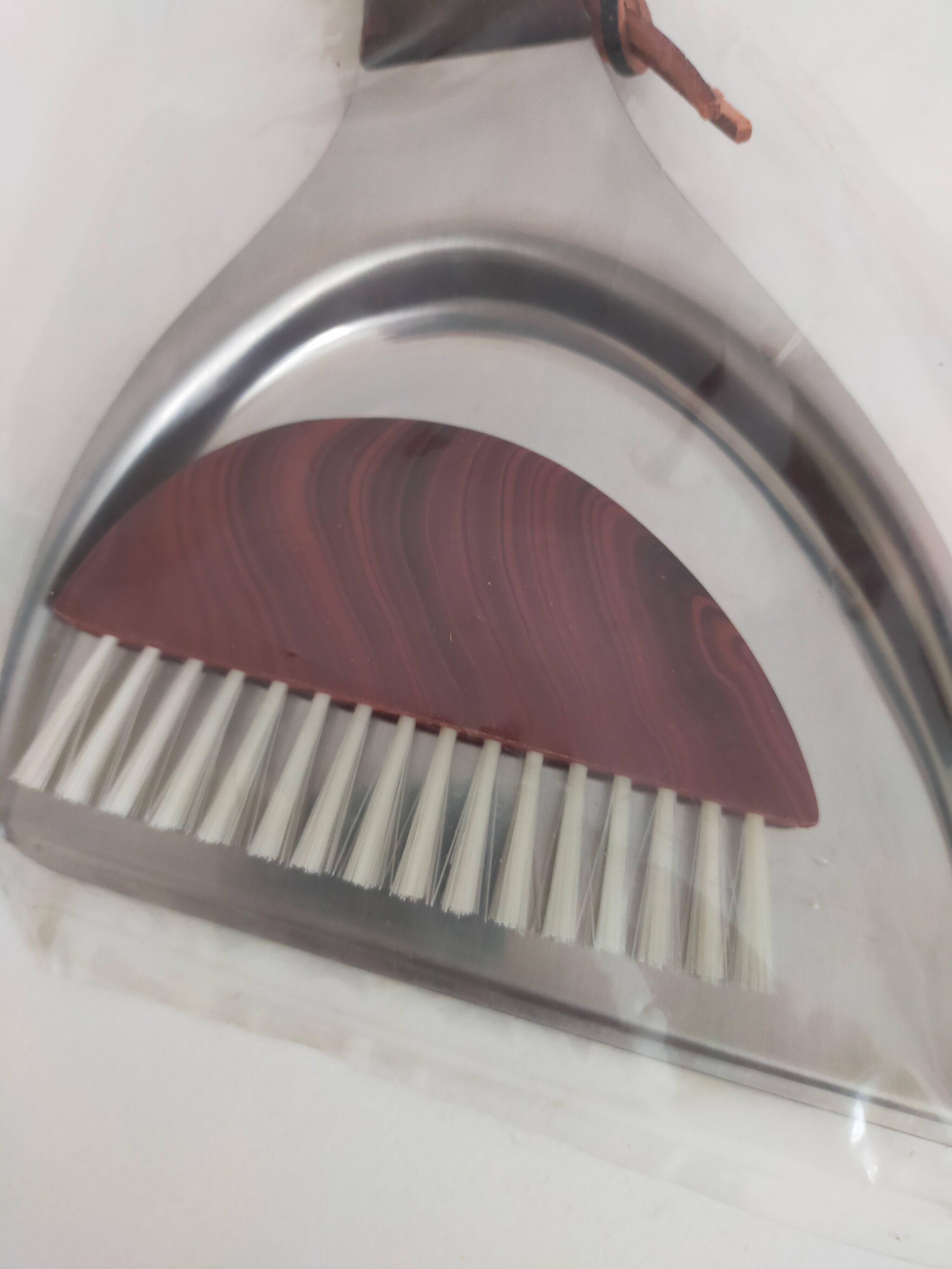 Picks up new vintage shovel and sweeper crumbs