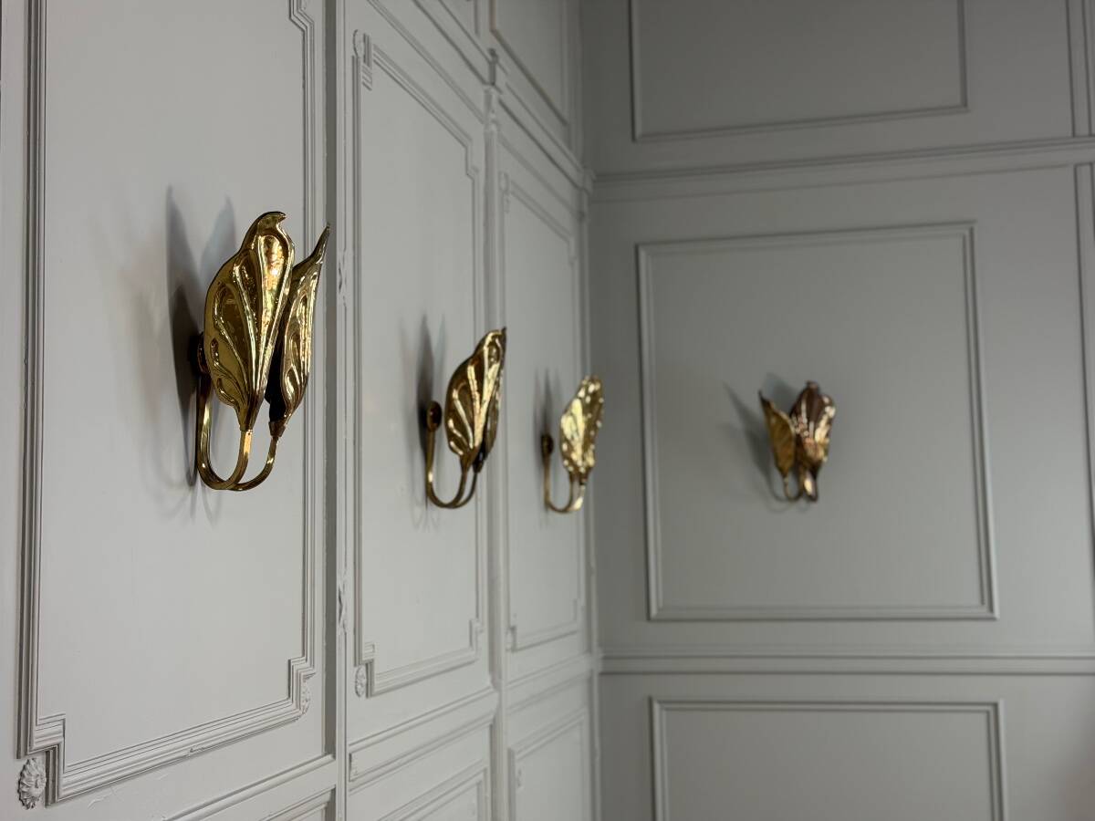 Set of four gilt brass wall lights, Tommaso Barbi, circa 1960.