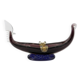 Murano glass gondola placed on a blue water-effect glass base