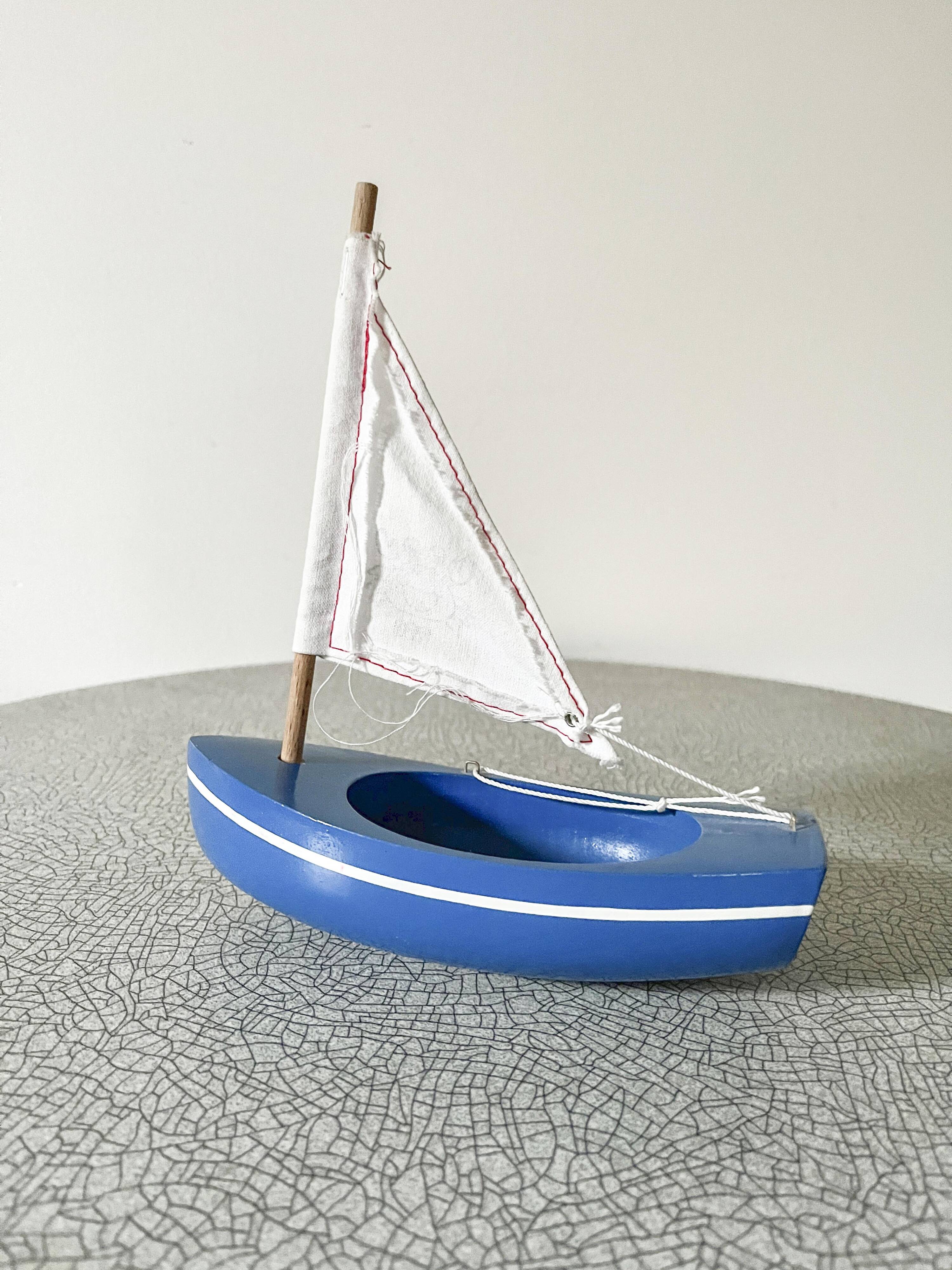 Blue basin sailboat from the French brand Tirot 200, vintage toy.