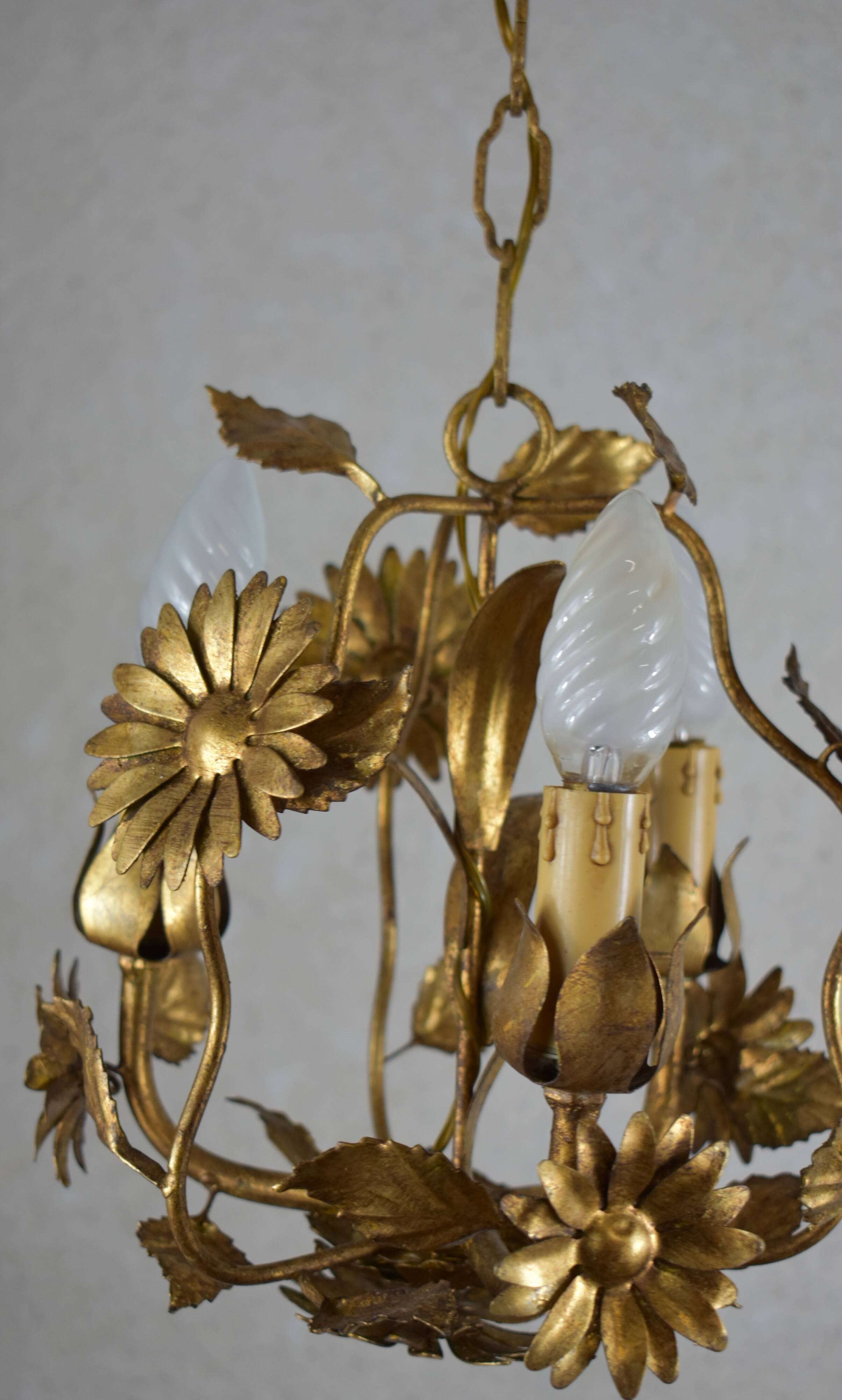 golden chandeliers with flowers.