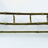 Bamboo-like coat rack in bronze