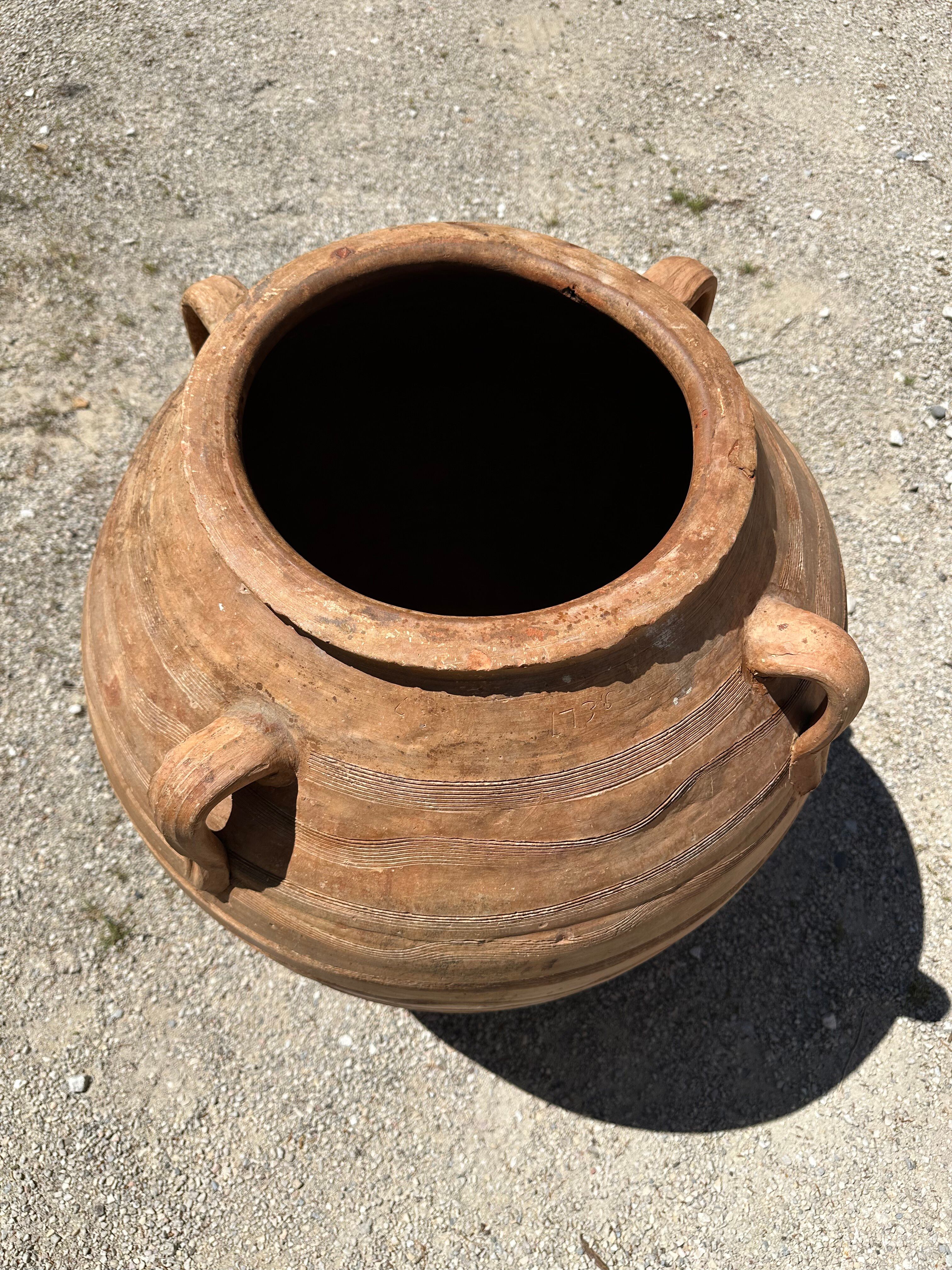Ancient terracotta pottery jar from the 19th century.