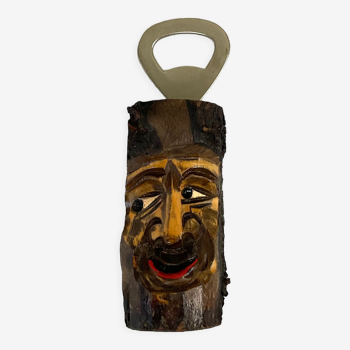 Vintage wooden bottle opener with carved tree face