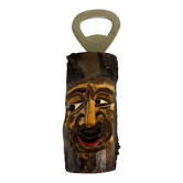 Vintage wooden bottle opener with carved tree face