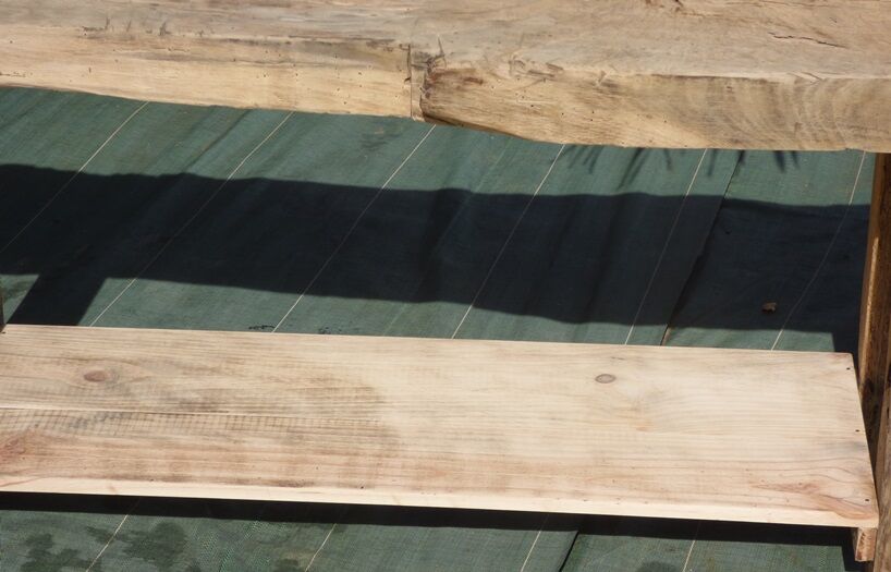 Workbench in raw solid wood with its shelf