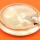 1970s Onyx ashtray with a gold metal rim.