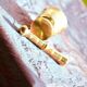 Mortar and its brass pestle with oriental gold and silver motifs
